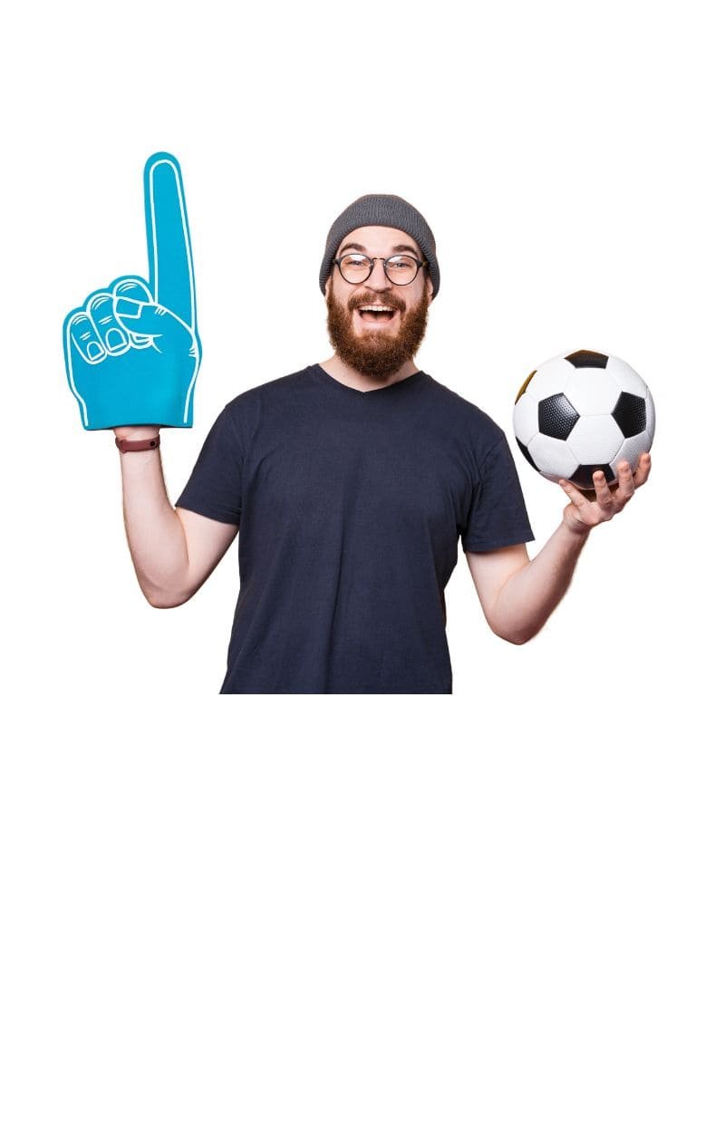 a person holding a soccer ball in each hand and a foam finger in the right hand.